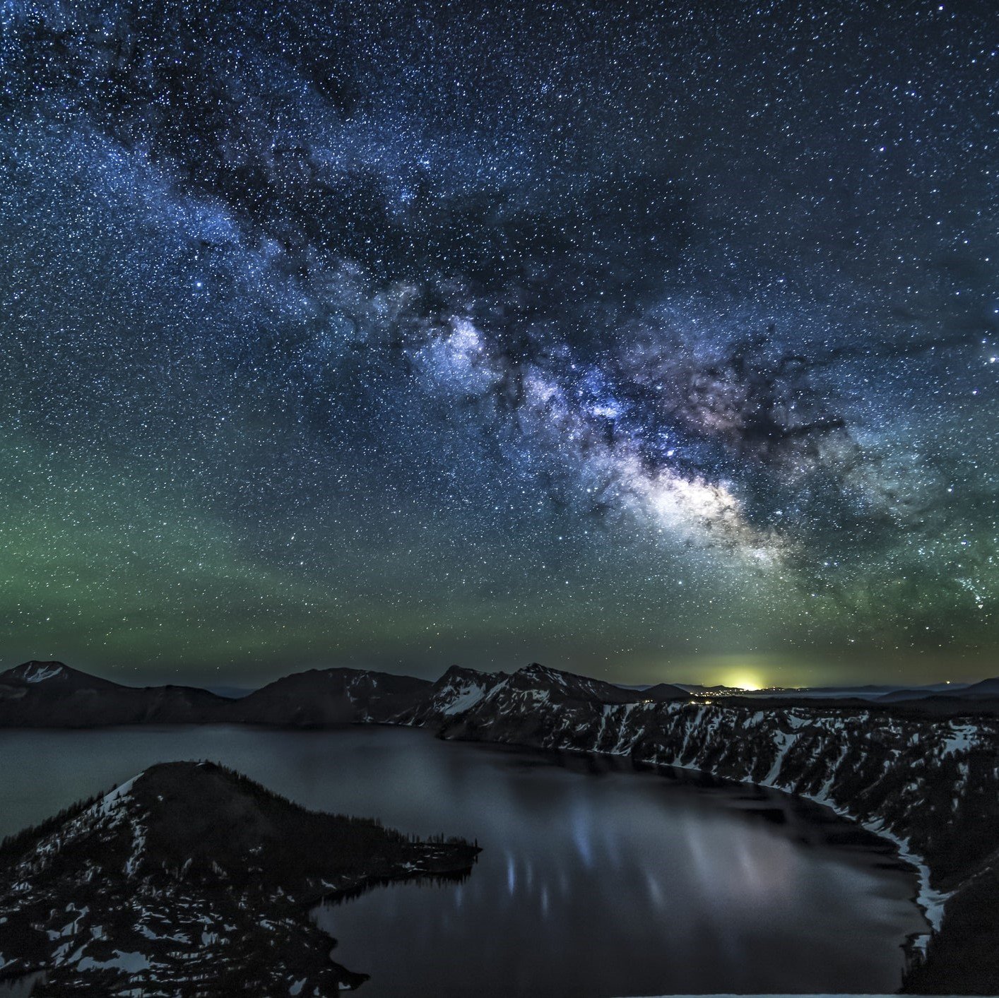 The Milky Way reflecting over Crater Lake in Oregon.